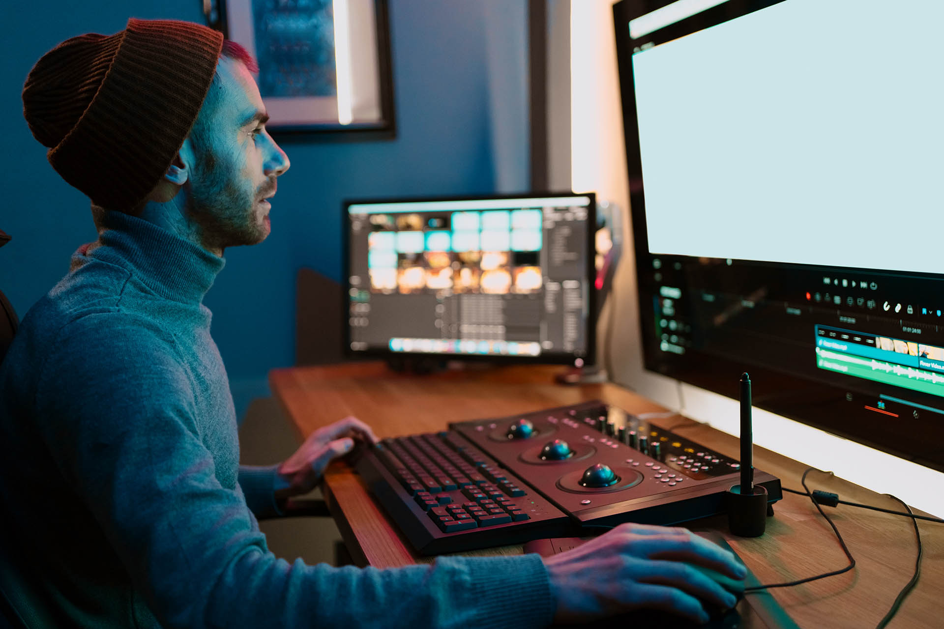 Male Video Editor Working on His Personal Computer with Big blank Display
