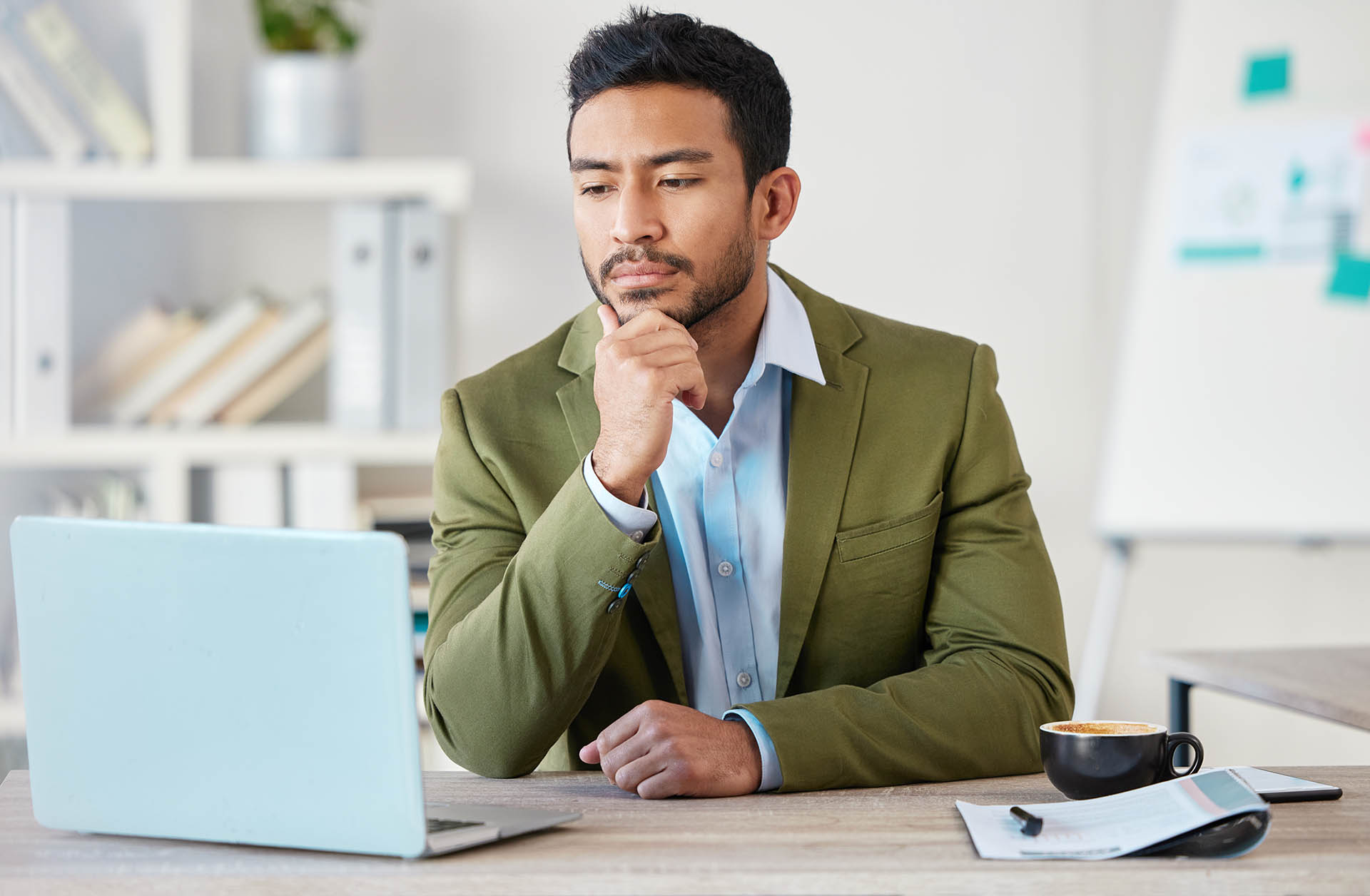 young-focused-mixed-race-businessman-working-alone-2024-06-28-00-46-38-utc